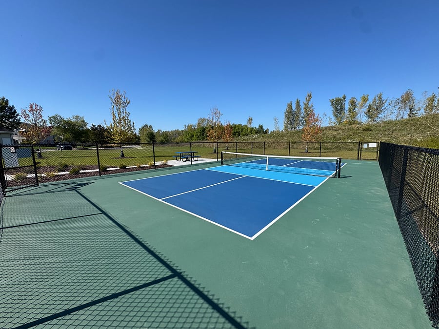 The community has a new outdoor pickleball court with great nature views that surround it.