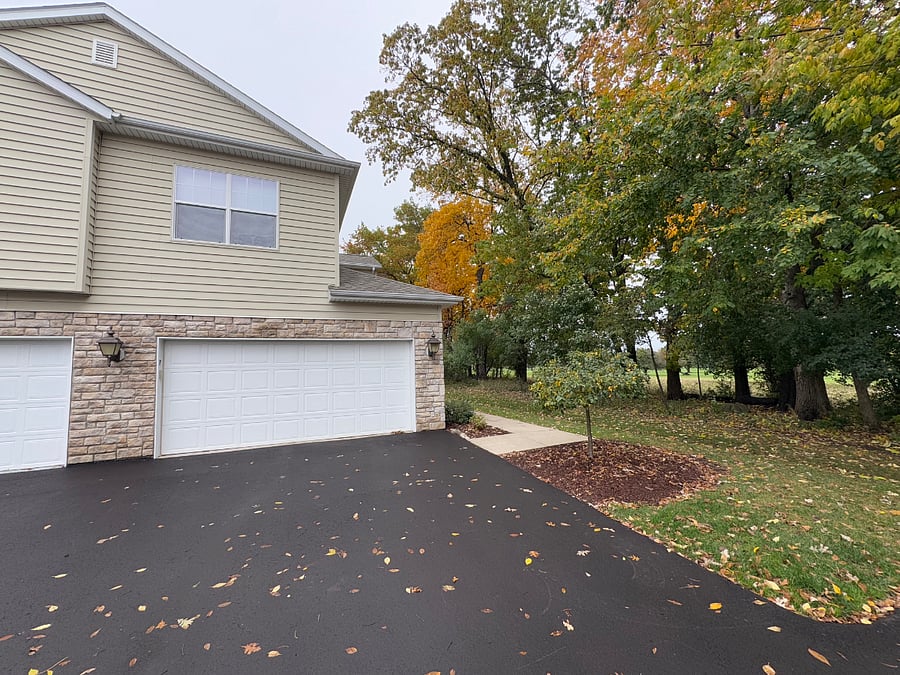 This upper unit has great privacy. Located along a tree line with views of the Pewaukee Golf Club. The unit features a 2 car attached garage.