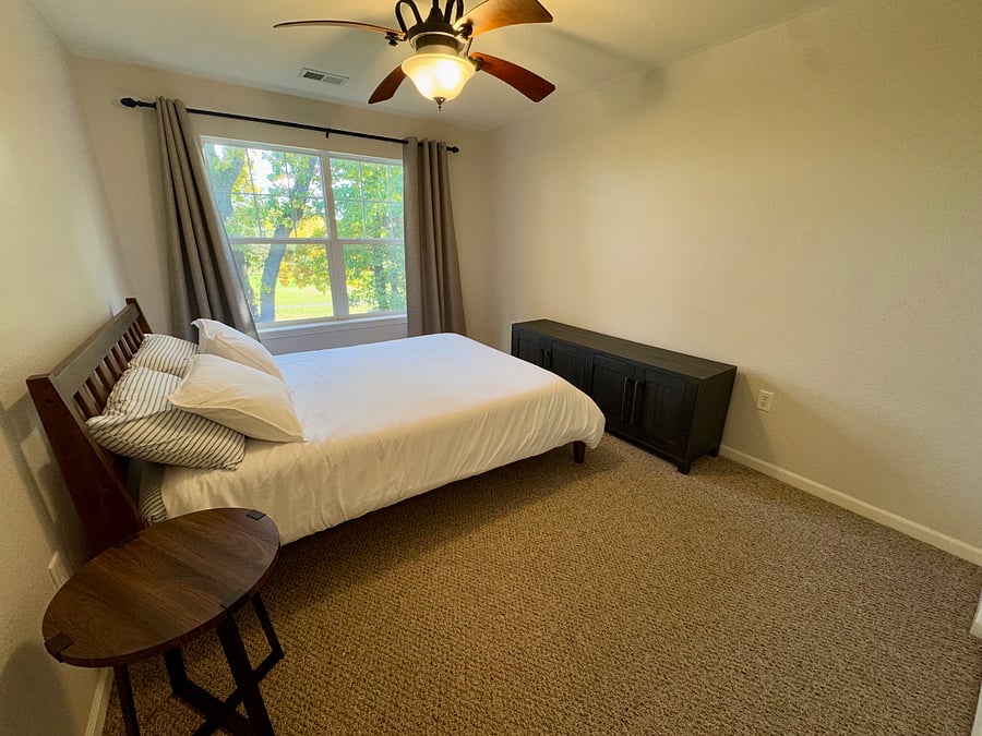 The secondary bedroom features a comfy queen size bed, a walk-in closet and great views!