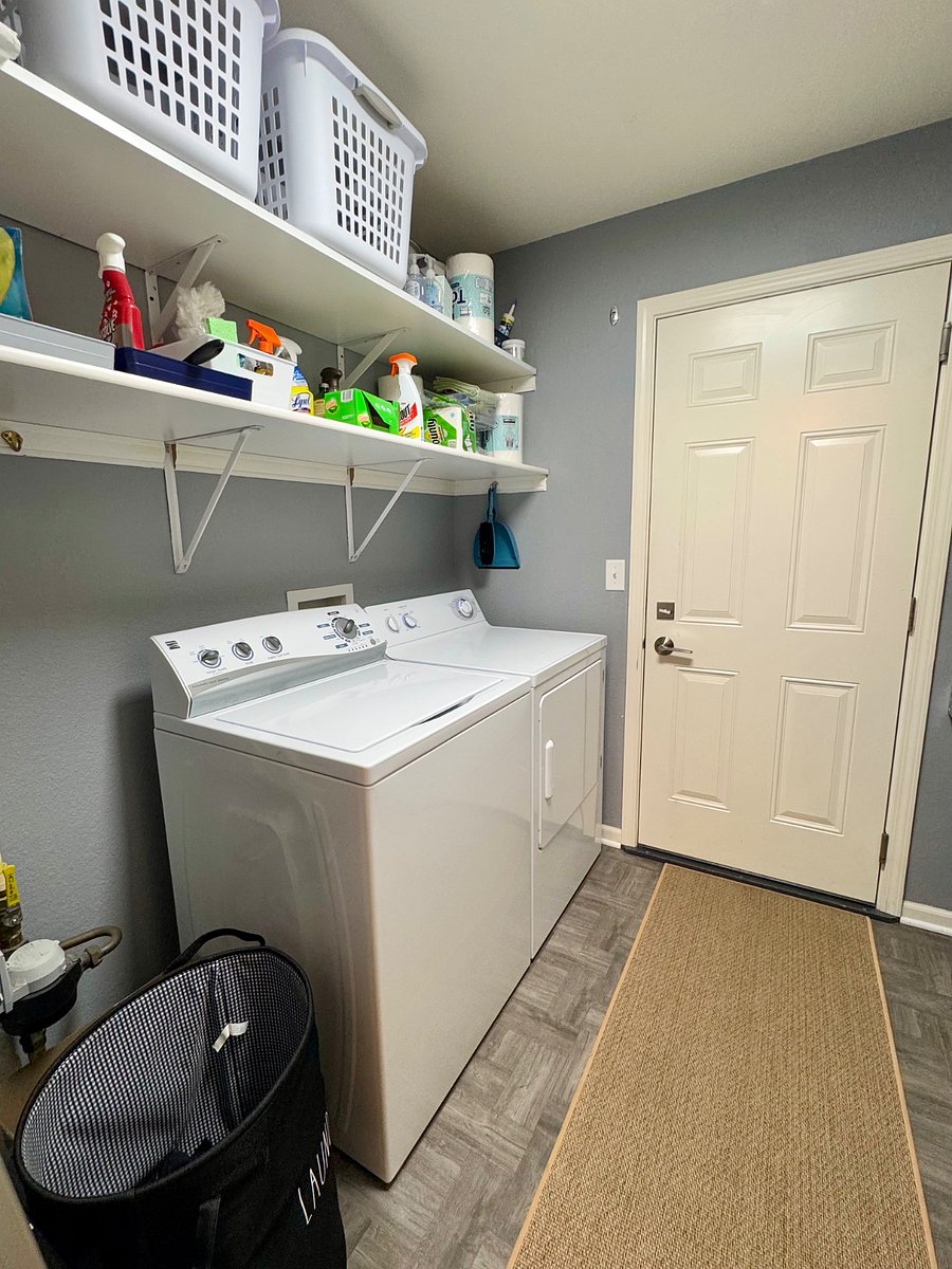 Washer and Dryer are located in the unit right next to the kitchen with stairs leading down to the attached 2 car garage.