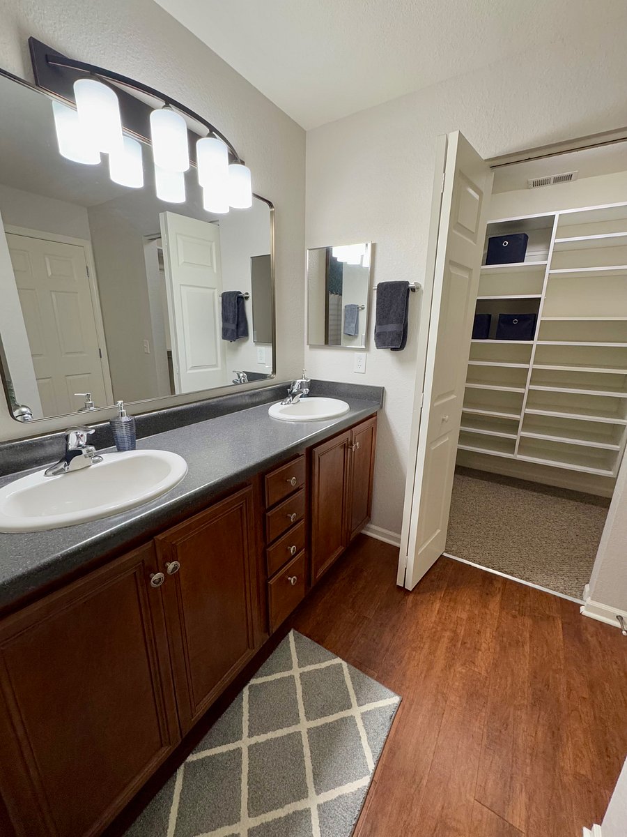The primary bathroom has dual sinks and a generous size walk-in closet.