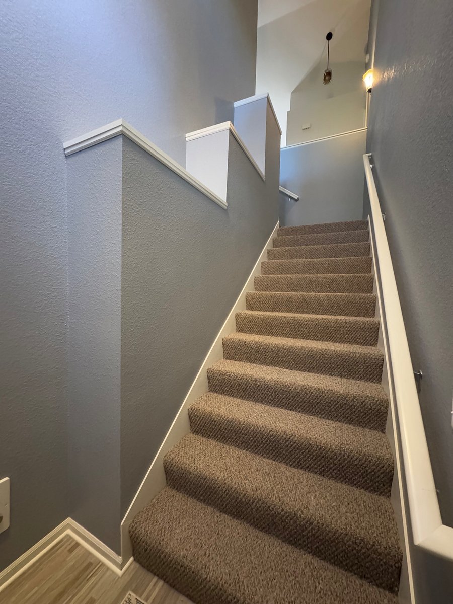Main Entrance interior stairs to the upper unit.