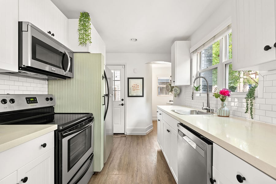 The bright and airy kitchen has been renovated with stainless steel appliances and dishwasher