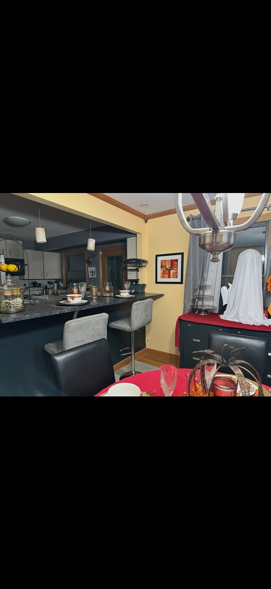 Bar seating between dining area and kitchen