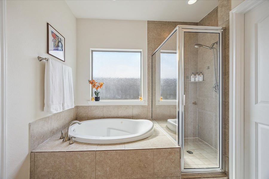 Soaking tub and separate shower.