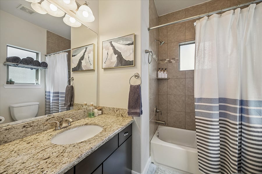 2nd bedroom attached bathroom with shower/tub combo.