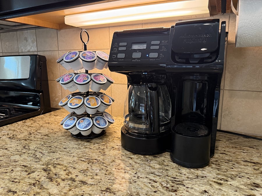Fully stocked kitchen with coffee maker, electric kettle, blender, toaster and microwave.