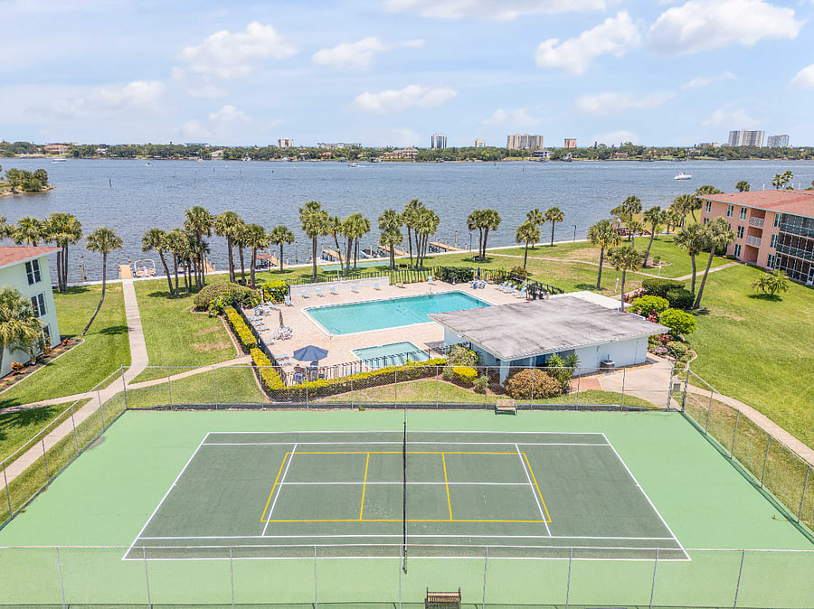 Beautiful tennis courts and pool with Halifax River views