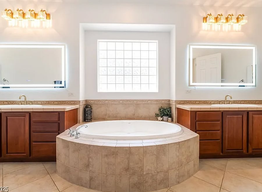 Master bathroom with duel sinks, jacuzzi tub and walk in shower. 