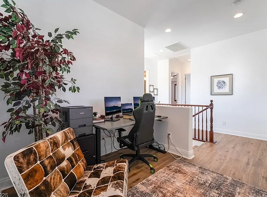 Upstairs work station with rising desk and printer. 