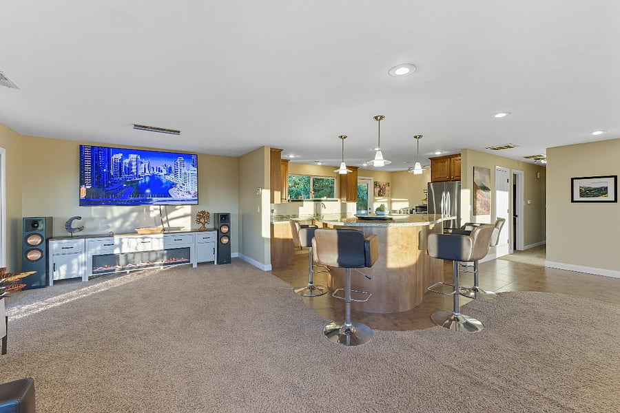 85 inch TV with entertainment center and fireplace