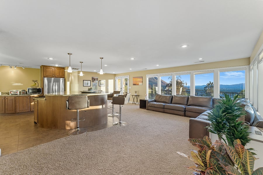 Open concept living room with so much natural light you might need sunglasses ;)