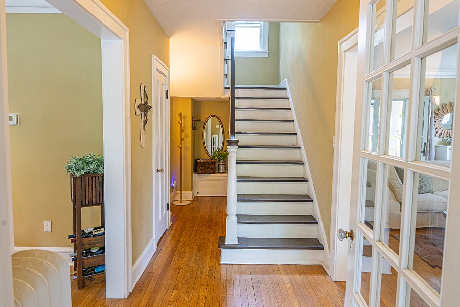 Half bath under the stairway that leads up to the bedrooms