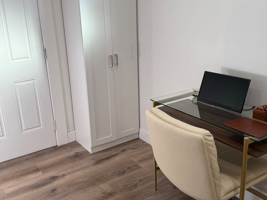Dedicated home office with extra screen, mouse pad, desk, and fast Wi-Fi. 