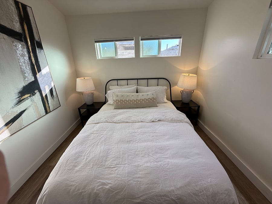 Very nice queen size bed with linen sheets, down, duvet, comfortable pillows, blackout, curtains, and chargers for your small personal electronics. 