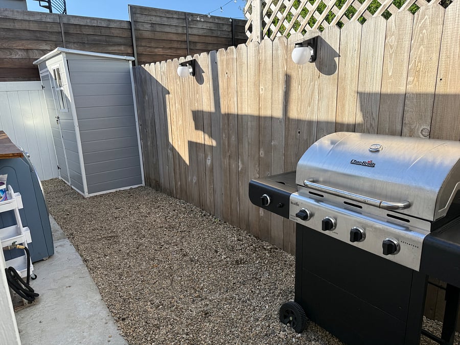 The gated backyard also has a barbecue and storage shed for your private use. 
