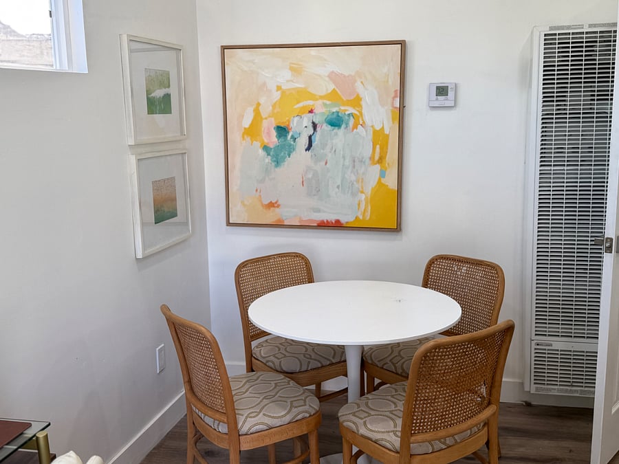 Cozy dining table with seating for four, six in a pinch. 