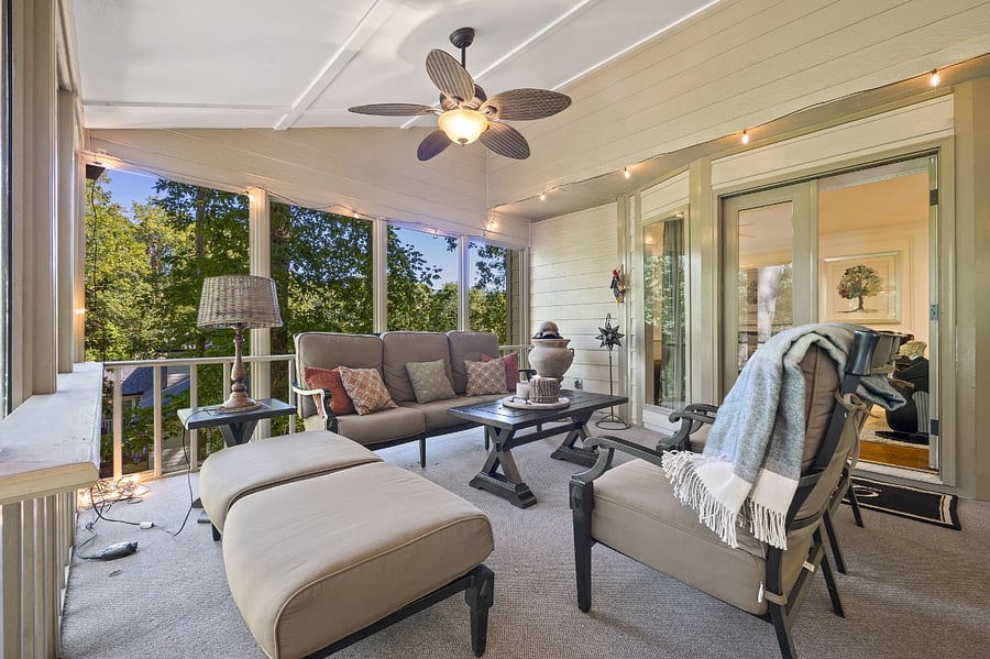 screened in patio with outdoor seating