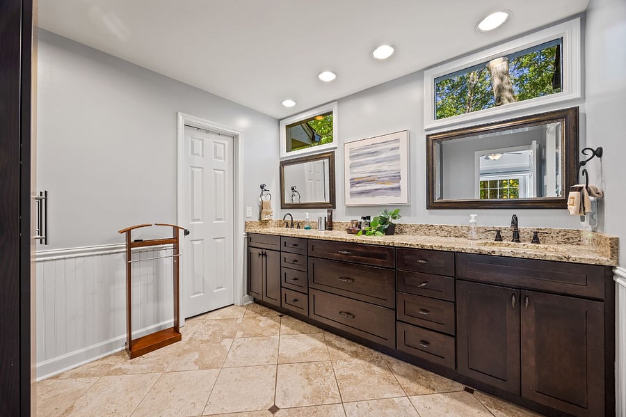 Master bathroom with double vanity, walk in closet, shower