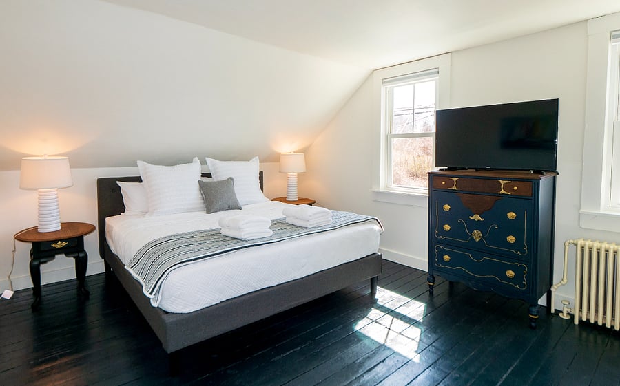King bedroom with dresser and closet