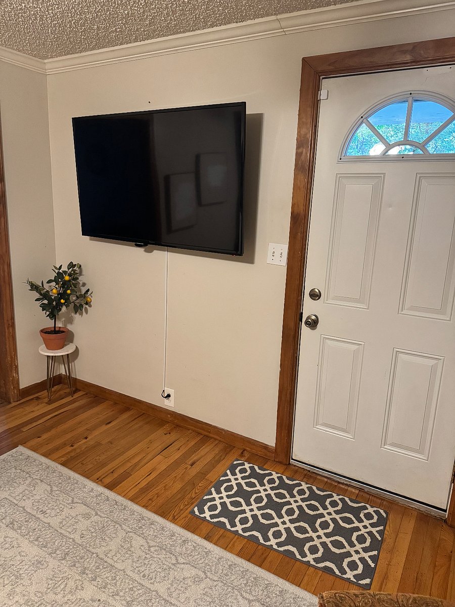 Living Room with Smart TV, black out curtains, ceiling fan