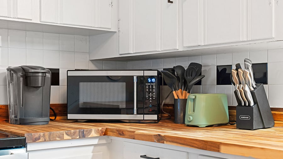 The kitchen is stocked with a Keurig, Microwave, Toaster, InstantPot, Mixer, Blender, and Air Fryer