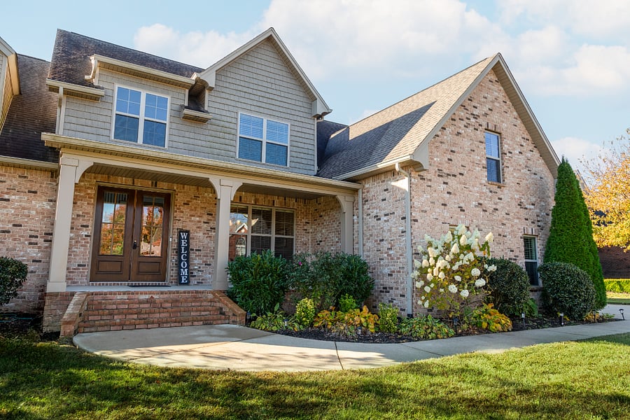 This has a grand entrance with a large sitting area on the front porch to enjoy the outside without the direct sunshine.