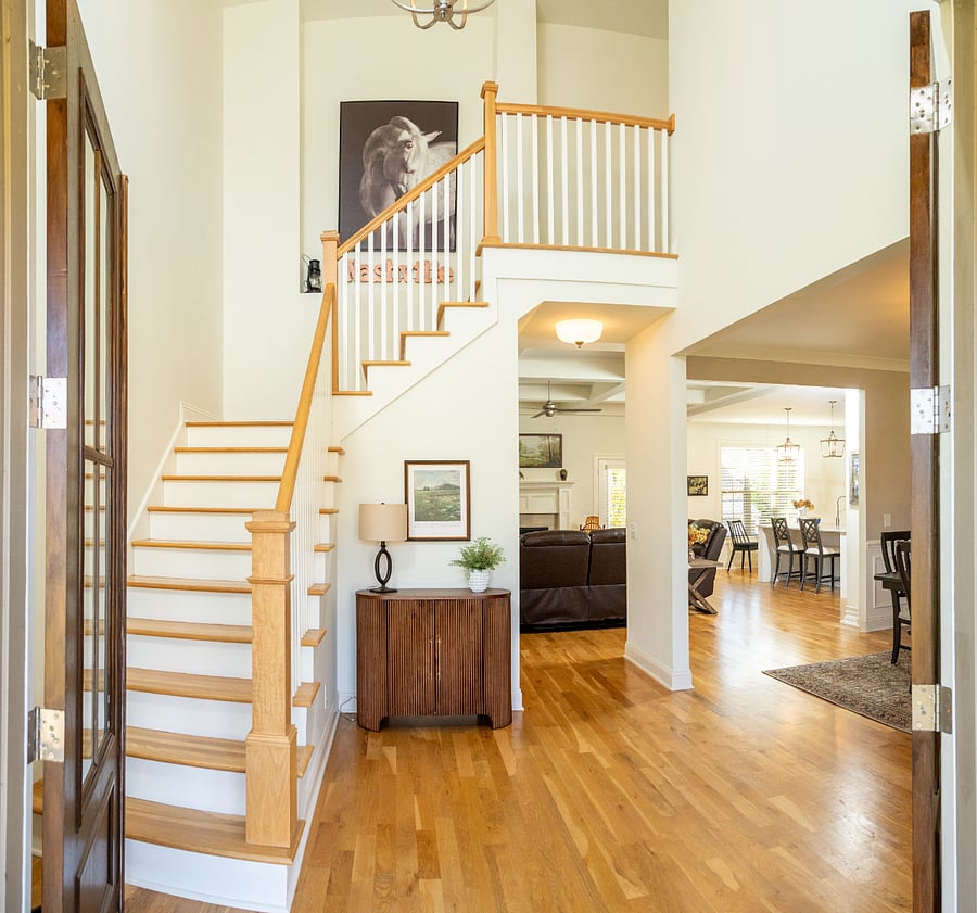 True grand southern living entrance. It's so stunning as you walk in the home. You will love how everything flows from room to room.
