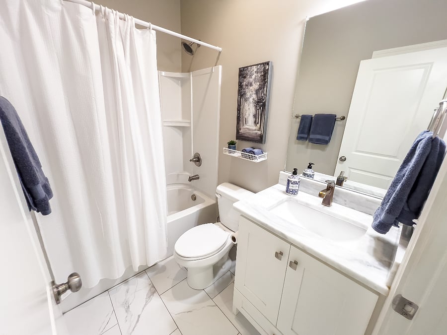 Main floor 2nd bathroom. Tub & shower combo and closet.