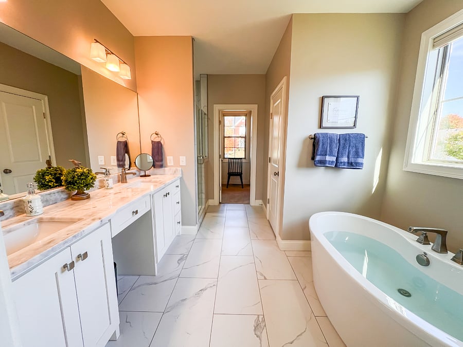 Large Master Bathroom with double sink, deep soaking tub, large shower, walk-in His and Hers closet.