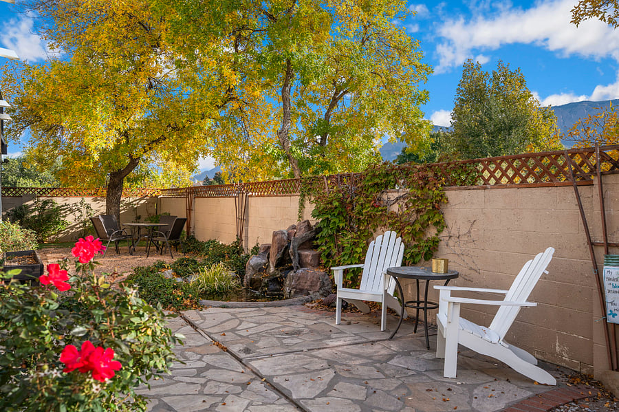 Gorgeous rose bushes/trees throughout- yard backs up directly to park and walking trails
