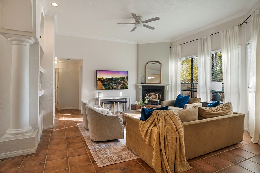 Ample seating- deep sofa and love chair/ swivel chairs- where everyone can be together- gas log fireplace and smart TV