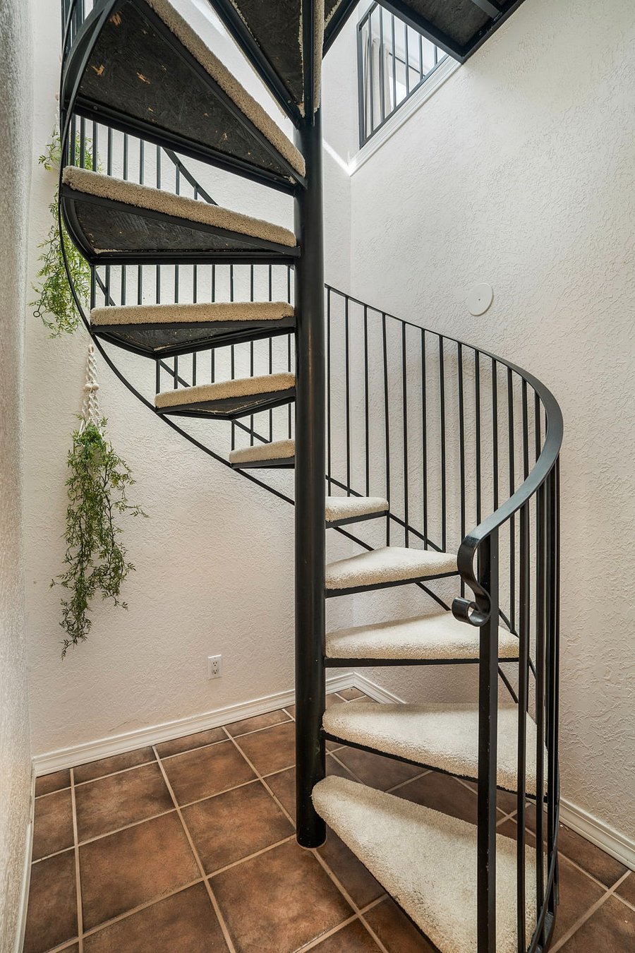 gorgeous and functional spiral staircase leading to second story