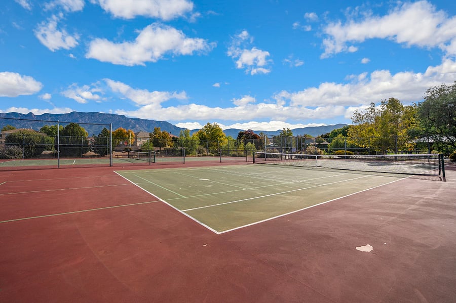 Tennis courts directly behind home- can see from upstairs balcony!