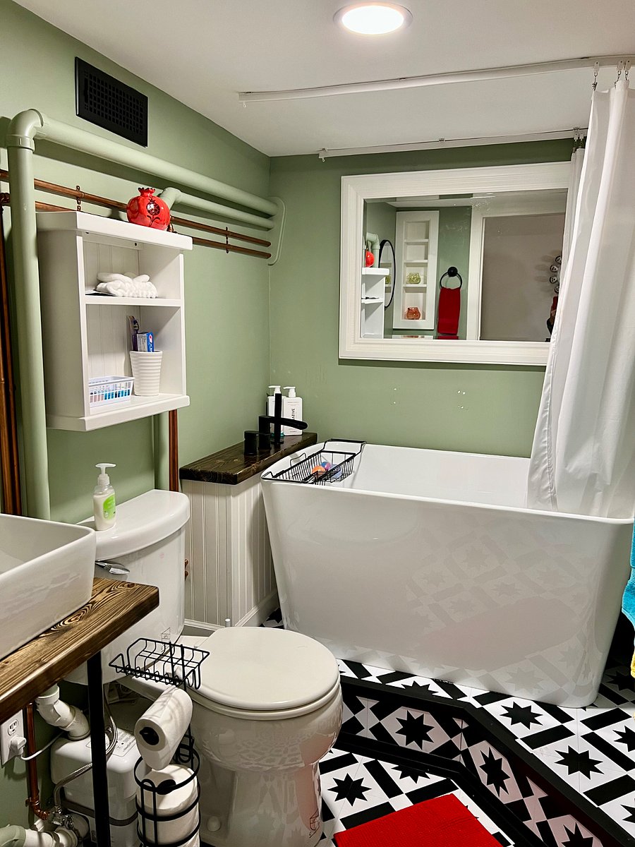 Soaking tub with built-in seat & hand-held shower head