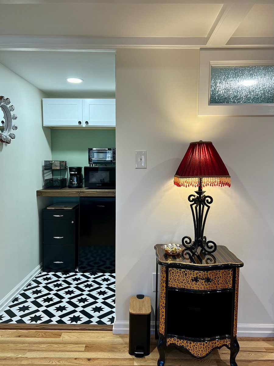 View of kitchenette with new appliances (microwave, toaster oven, Mr Coffee & small fridge)