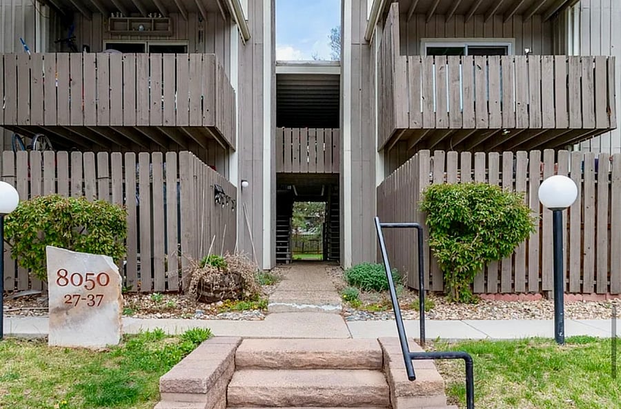 Front view of condo building, unit is at the back of the building to the left.