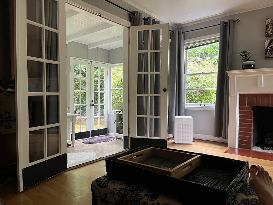 Attached sunroom leading to backyard