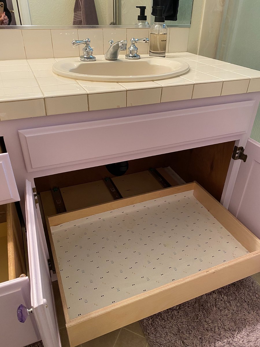 Pull-out storage under bathroom sink.