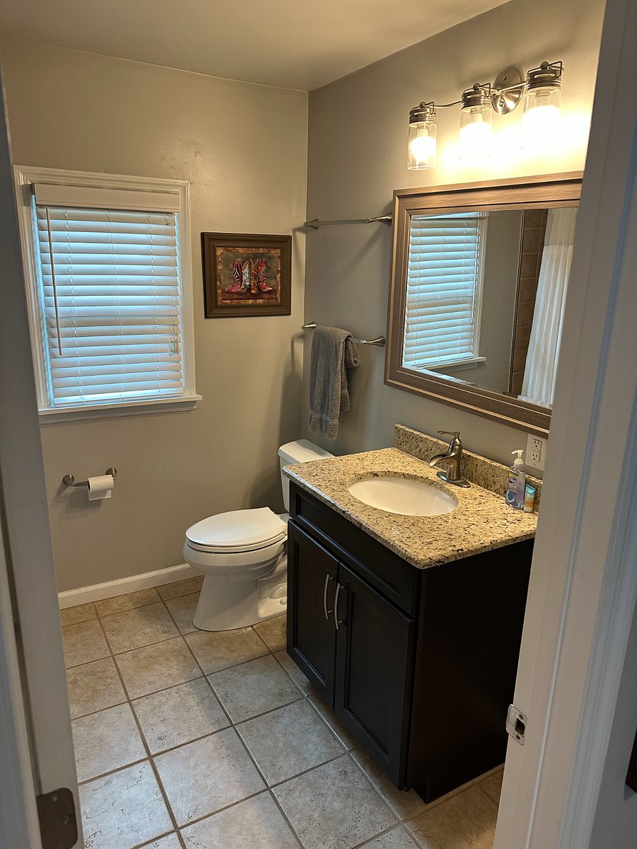 Second bathroom upstairs outside of the bedroom. Has shower.