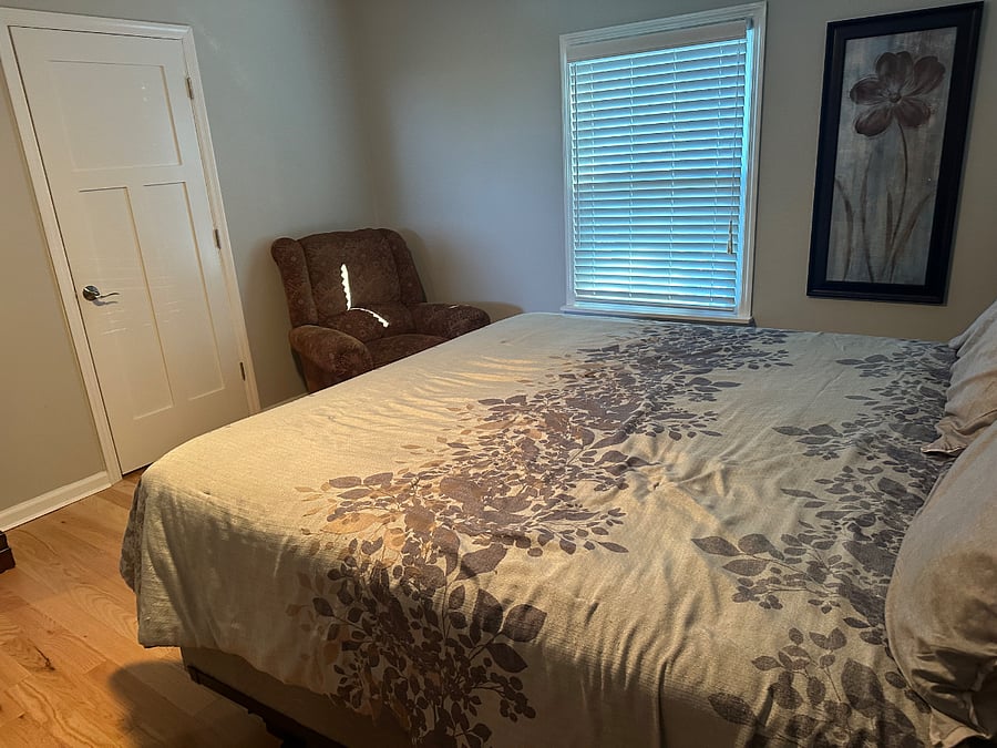 Second king size bedroom upstairs with a bath. Full bath with shower. Note the recliner