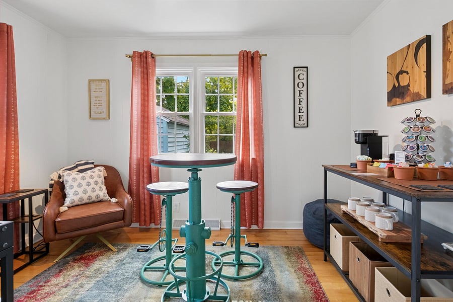 Start your day in styleour Sunshine Lounge features a high-top table and unique bike-pedal stools, perfect for morning coffee, family games, or a cozy hangout near Notre Dame.