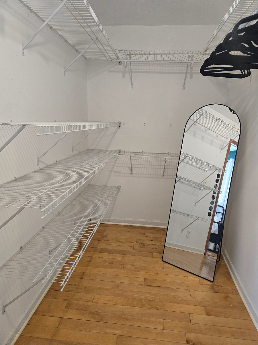 The large walkin closet provides abundant storage space and features a fulllength mirror for easy daily routines.
