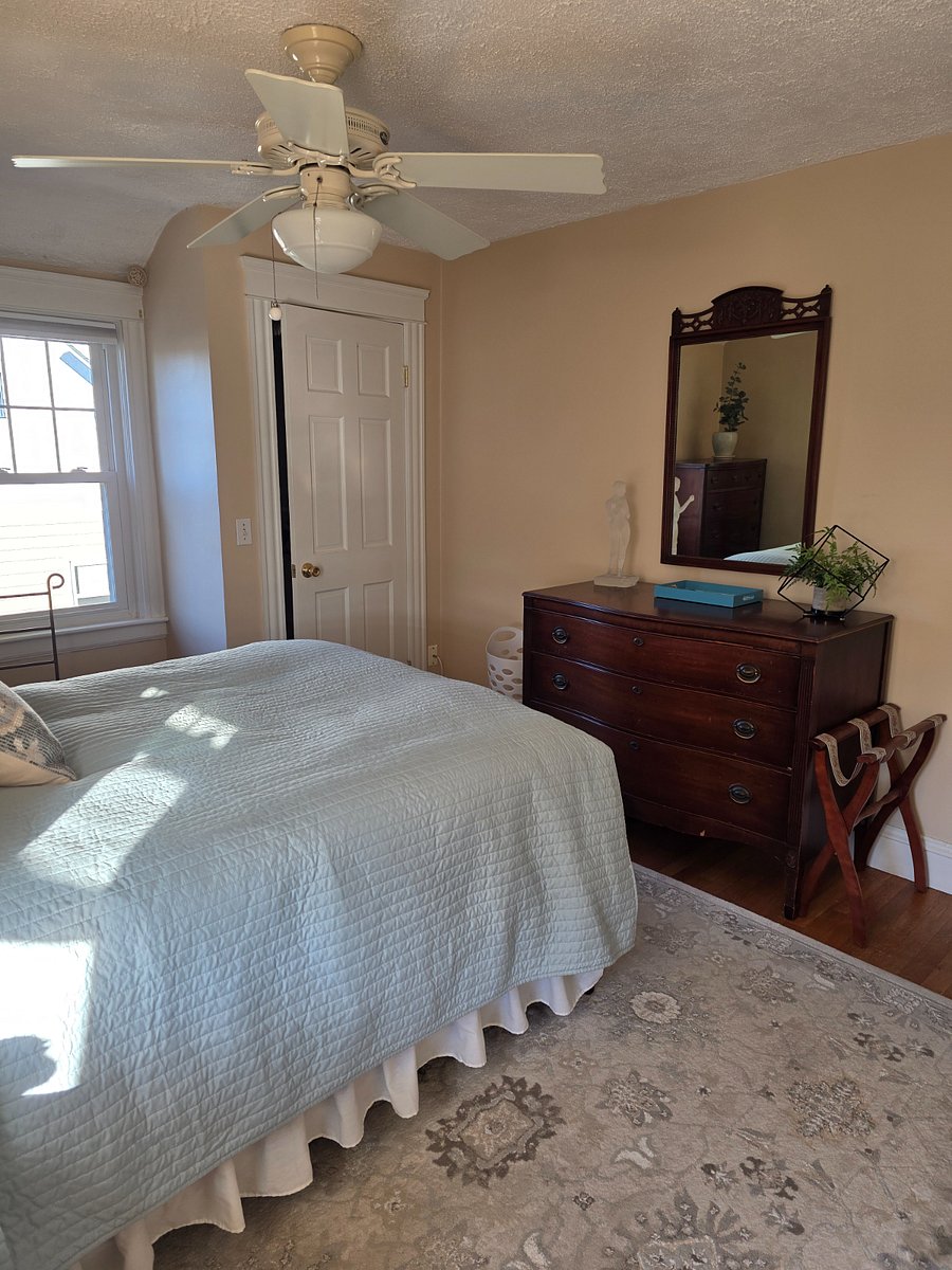 Upstairs bedroom with closet and window detail