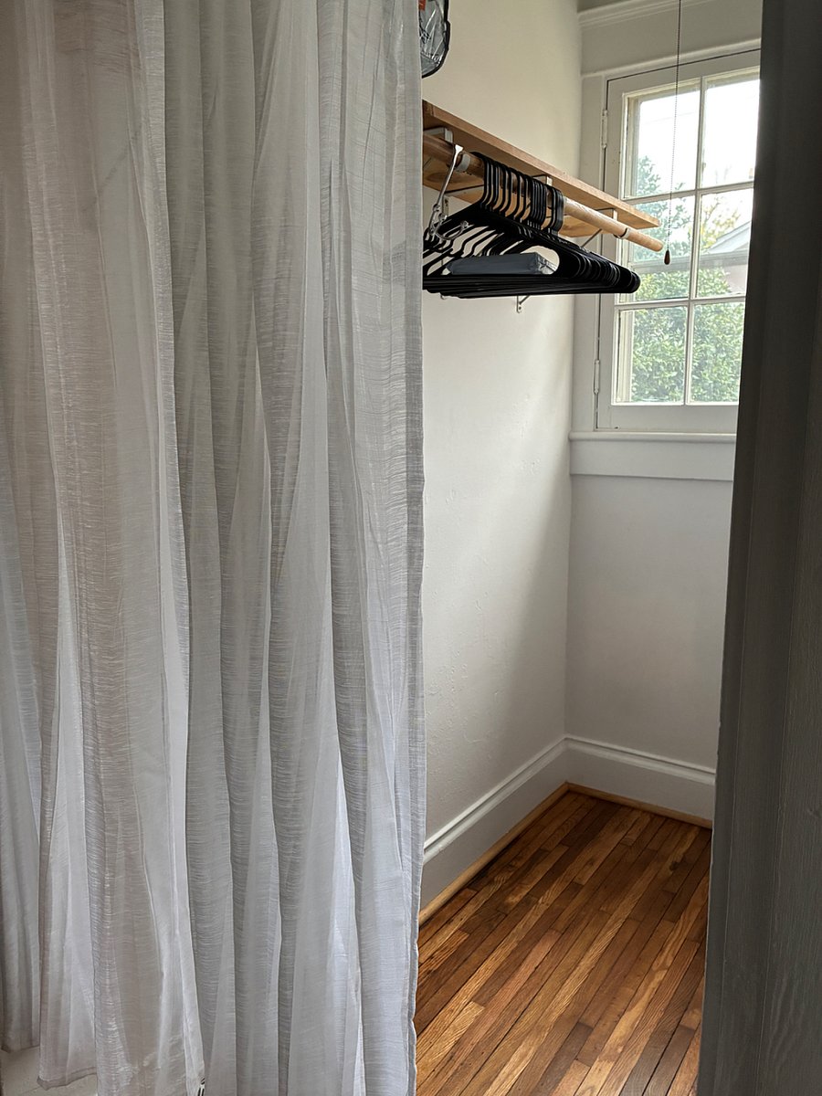 Spacious, well-lit walk-in closet.