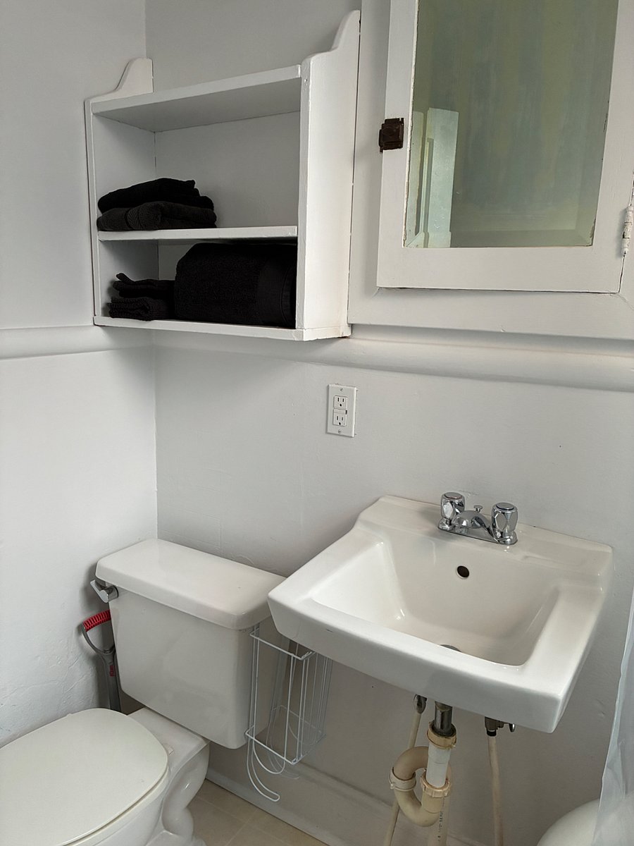 Charming built-in cabinets for toiletries and towels.