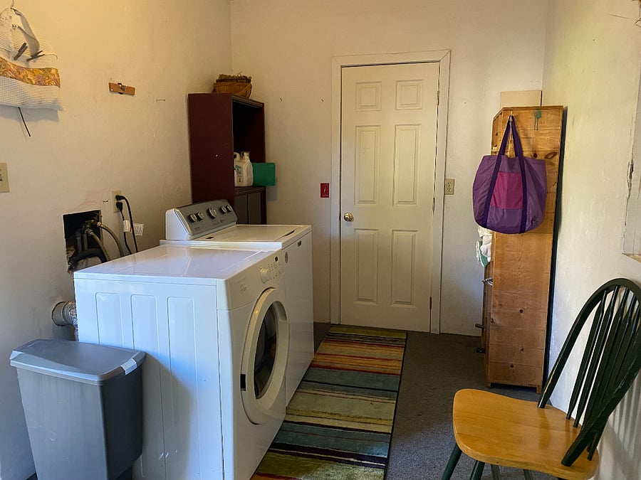 LAUNDRY ROOM HAS PLENTY OF STORAGE SPACE
