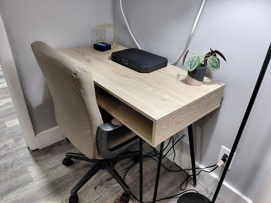 Desk area with lighting and Internet modem. WiFi network included with rent. 