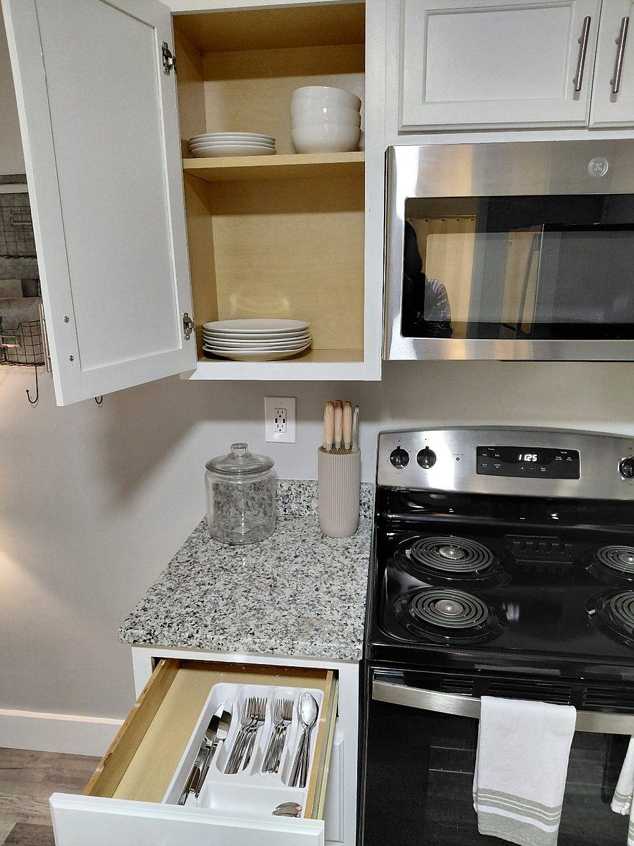 Kitchen comes with dishes, kitchen utensils, and silverware. Kitchen towels, Keurig, toaster, pots, and pans also included. 