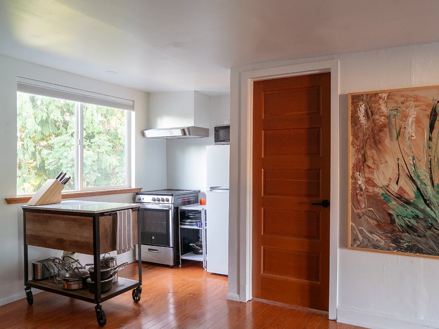 Enjoy the full kitchen with stove, microwave, fridge, and island.